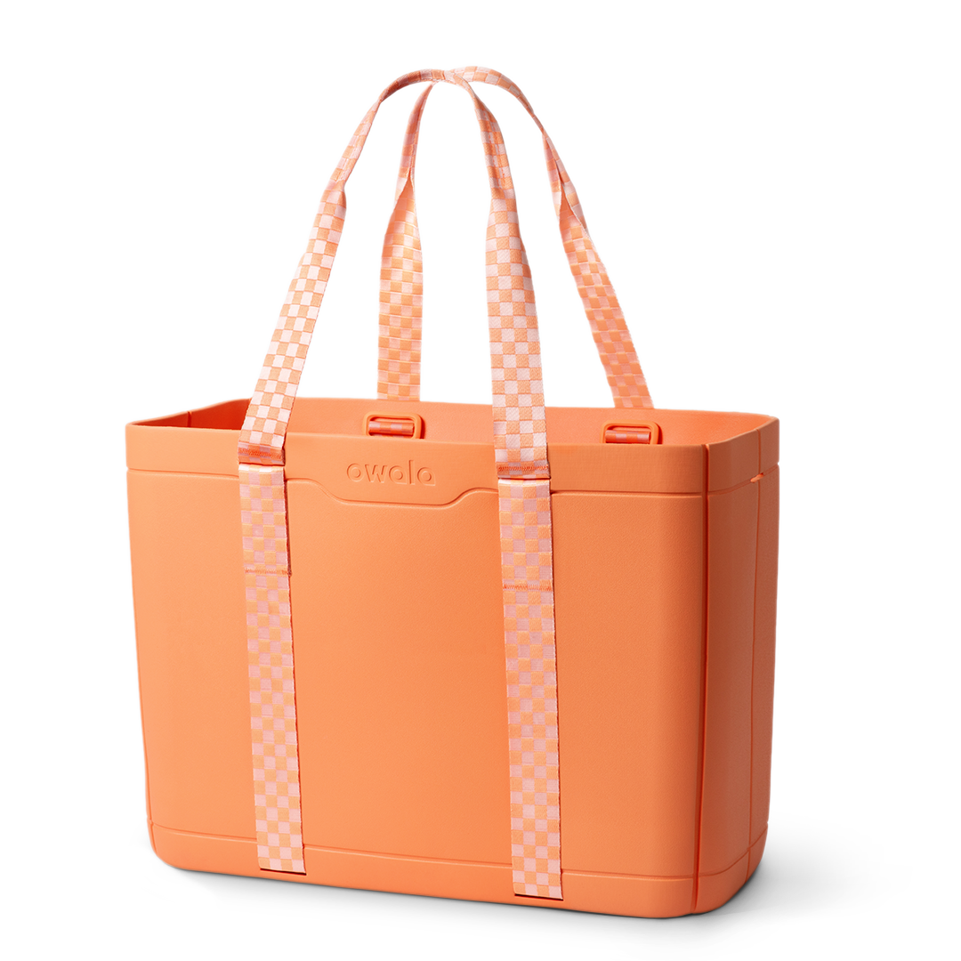 Sun-Day Collapsible Tote in Hot Tropic, solid coral orange tote bag with light pink checkerboard patterned carry loops and matching strap