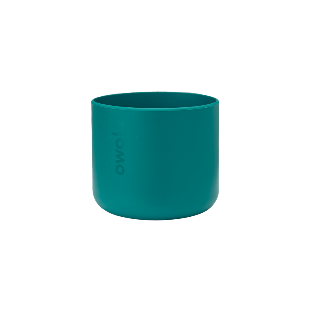 Bottle Boot 24oz in teal green silicone; small cylindrical form with Owala wordmark