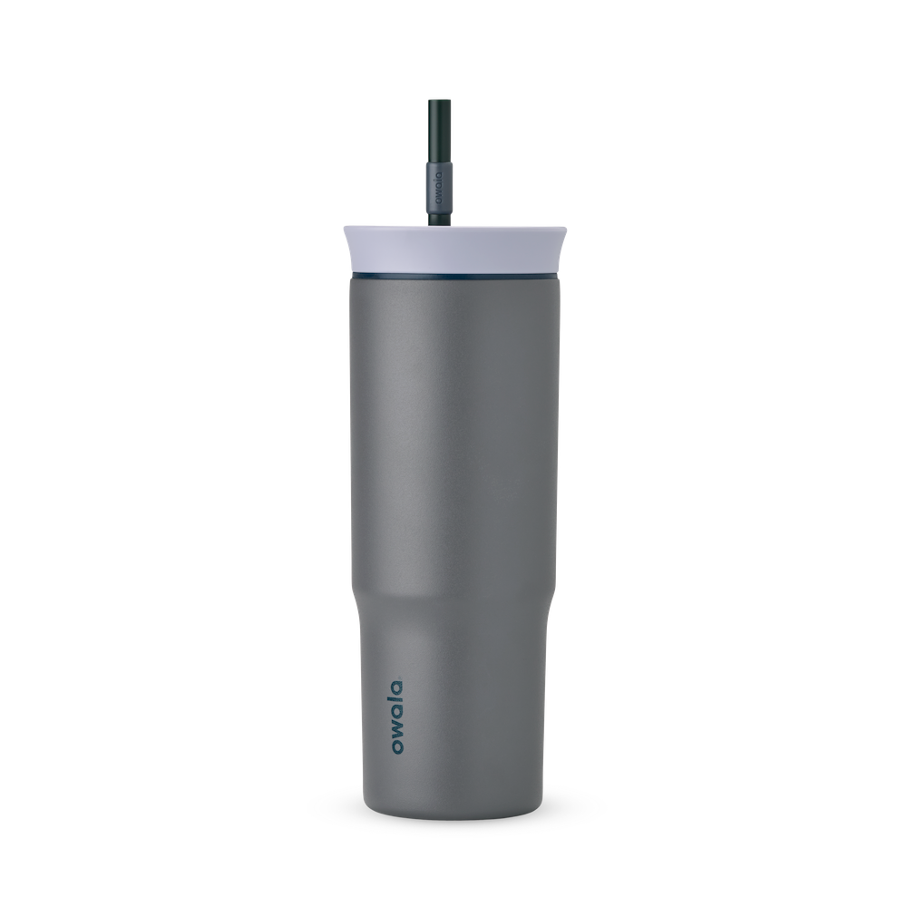 24oz Tumbler in Off the Grid; matte dark gray insulated tumbler with light lavender lid, navy blue accent ring, and dark teal straw, dark teal Owala wordmark on front