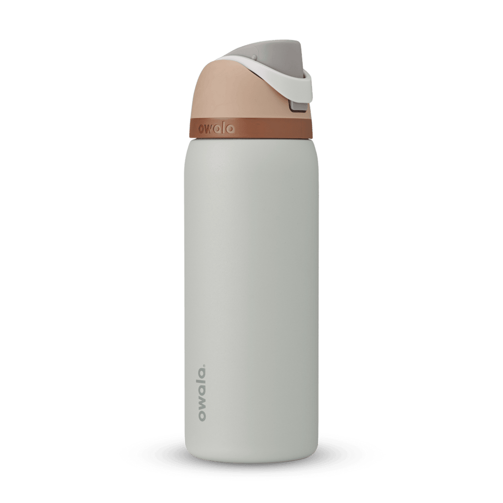 FreeSip 32oz in Calm Waters, pale gray body with peach flip cap, white carry loop, and copper accent band