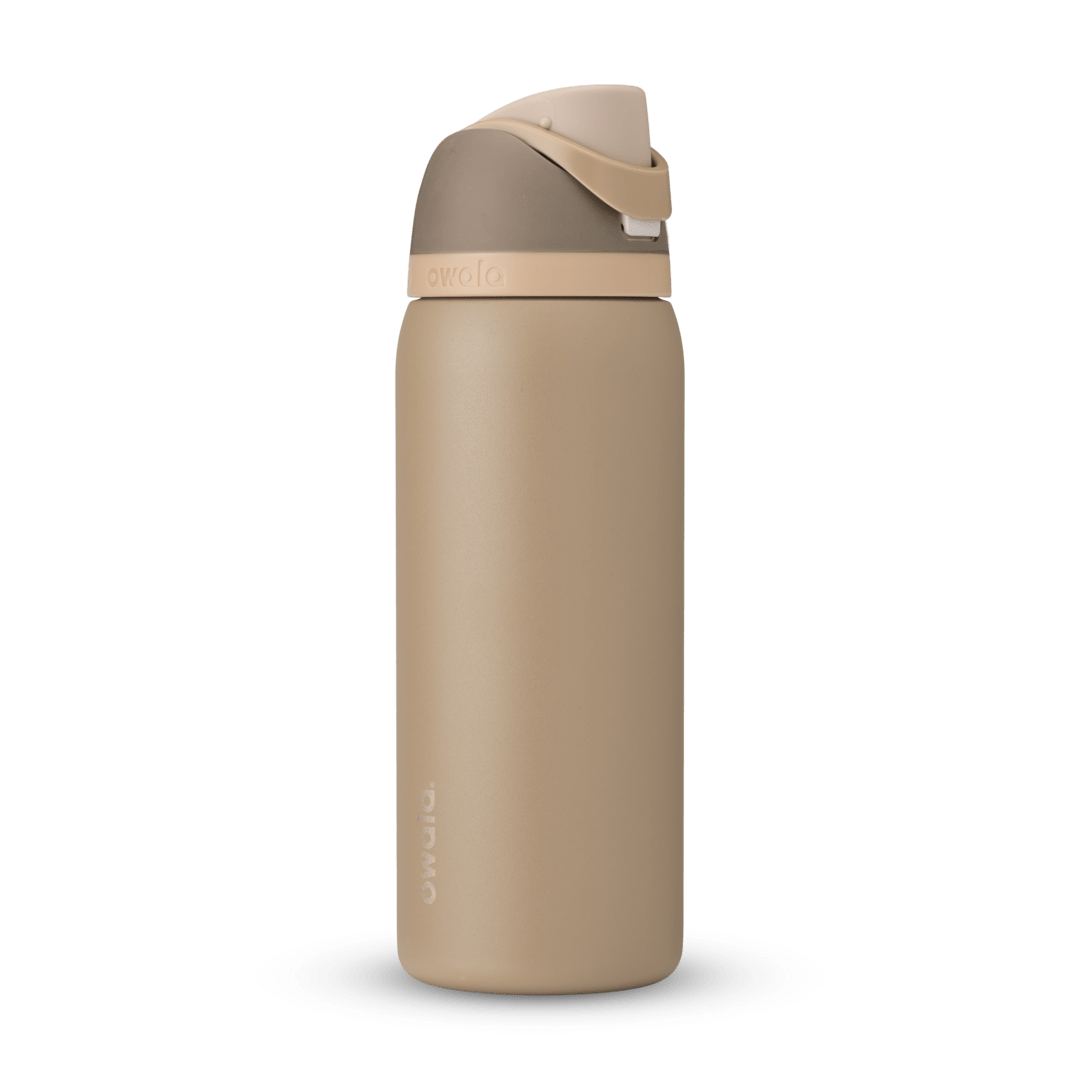 FreeSip 32oz in Down to Earth, warm sand/tan body with matching tan flip cap and carry loop
