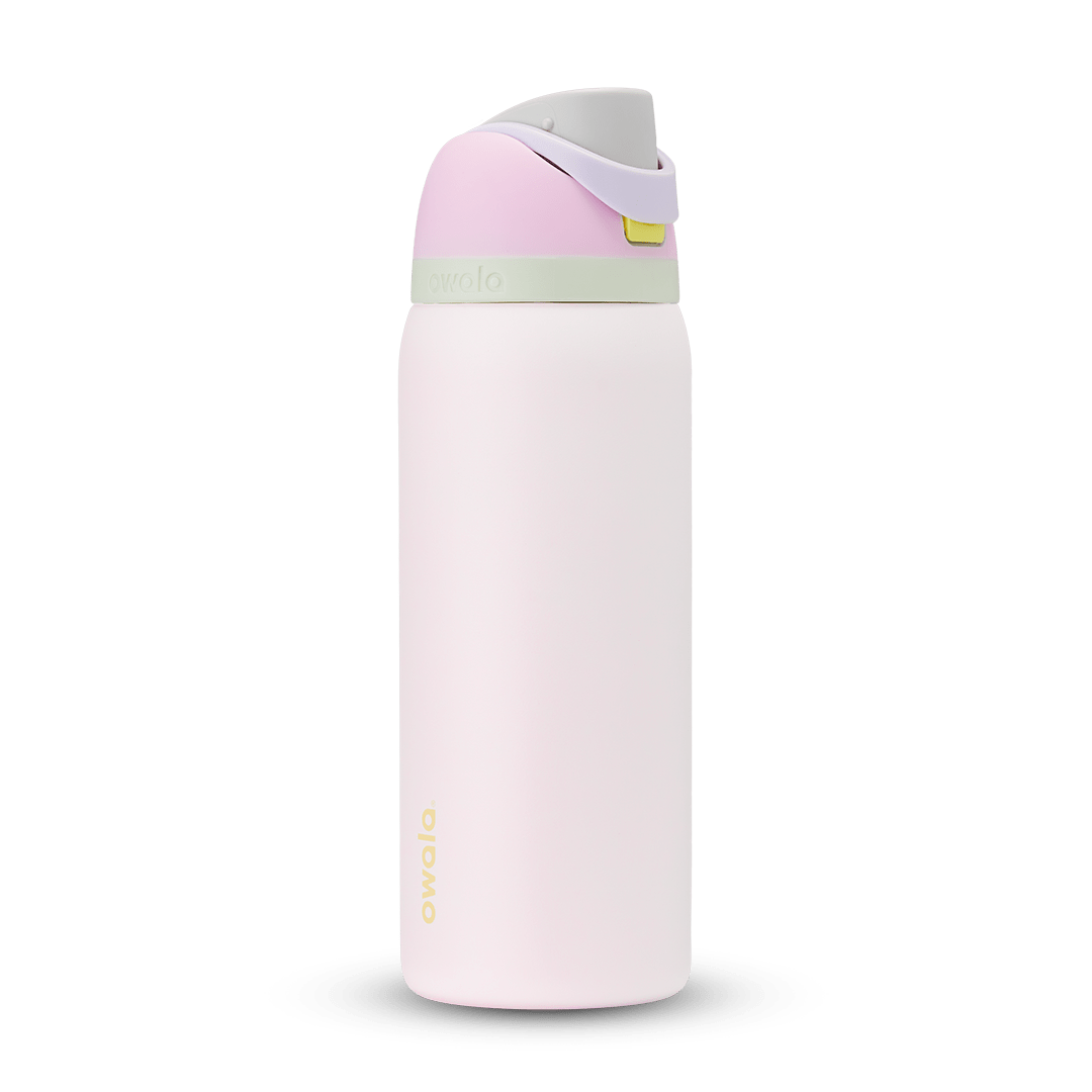 FreeSip 32oz water bottle, soft blush pink body with pale pink and sage green color-block flip cap