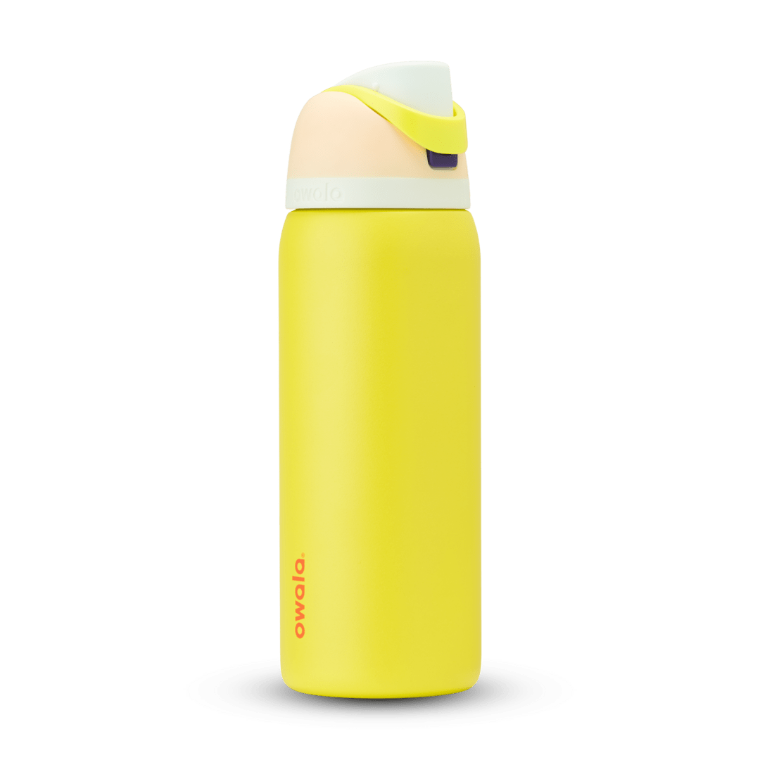 FreeSip 32oz water bottle, bright yellow body with pale cream and peach color-block flip cap
