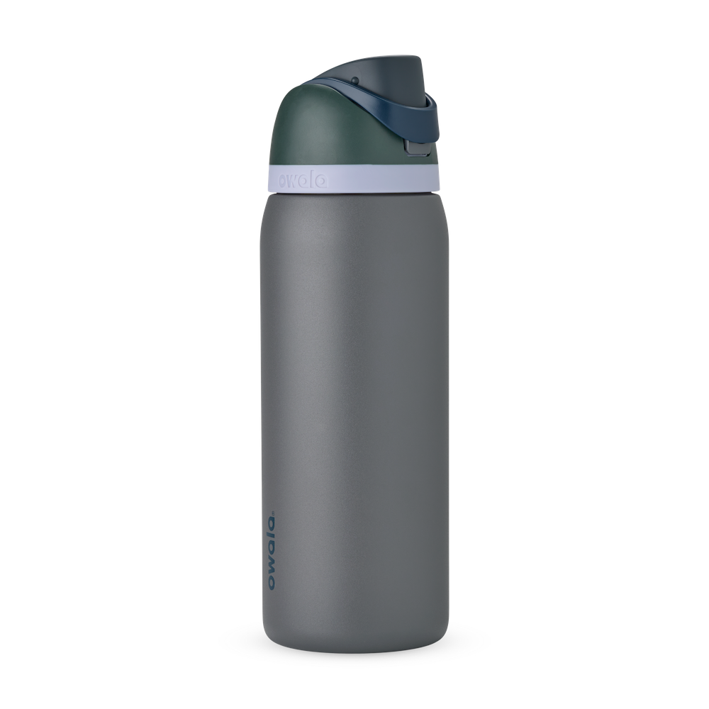 FreeSip 32oz in Off the Grid, charcoal grey body with dark forest green flip cap, navy blue carry loop, and pale lavender accent band