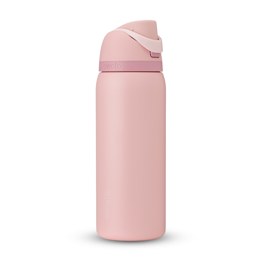 FreeSip 32oz water bottle, soft blush pink body with matching pink flip cap and carry loop