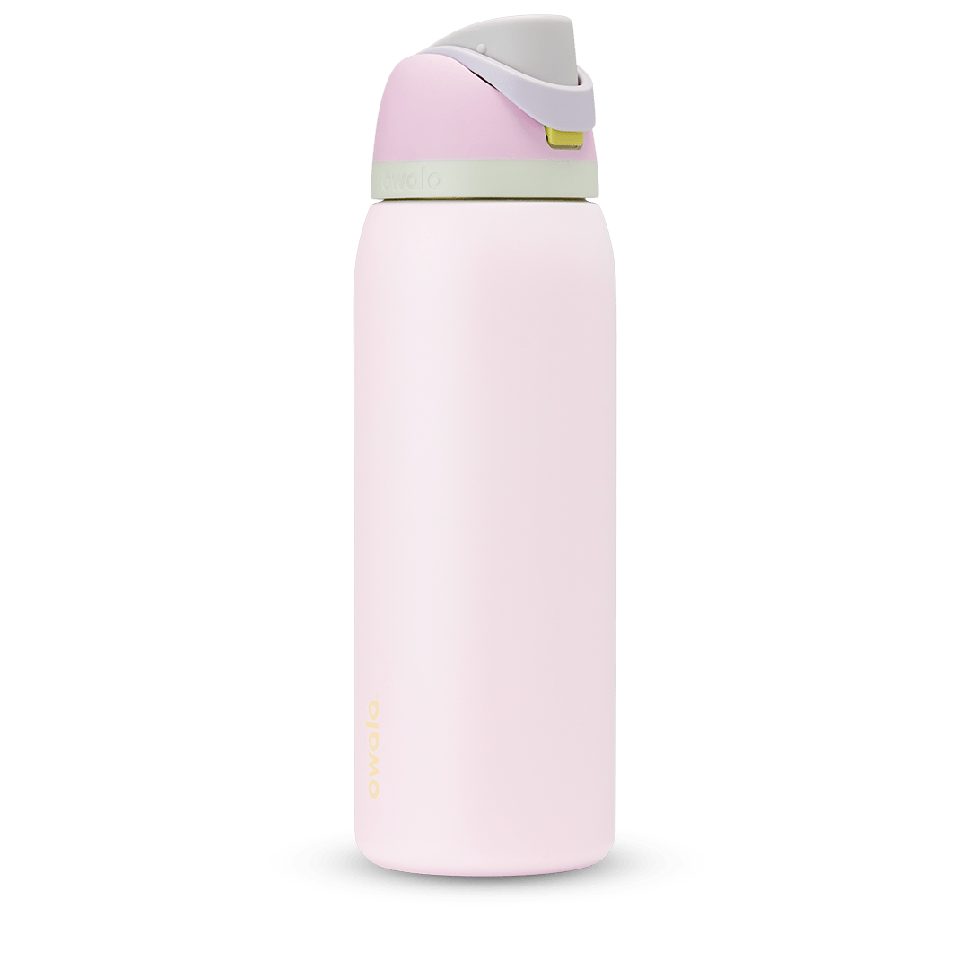 FreeSip 40oz in Candy Coated; soft pink body with pink flip cap, lavender carry loop, and sage green accent band on the lid