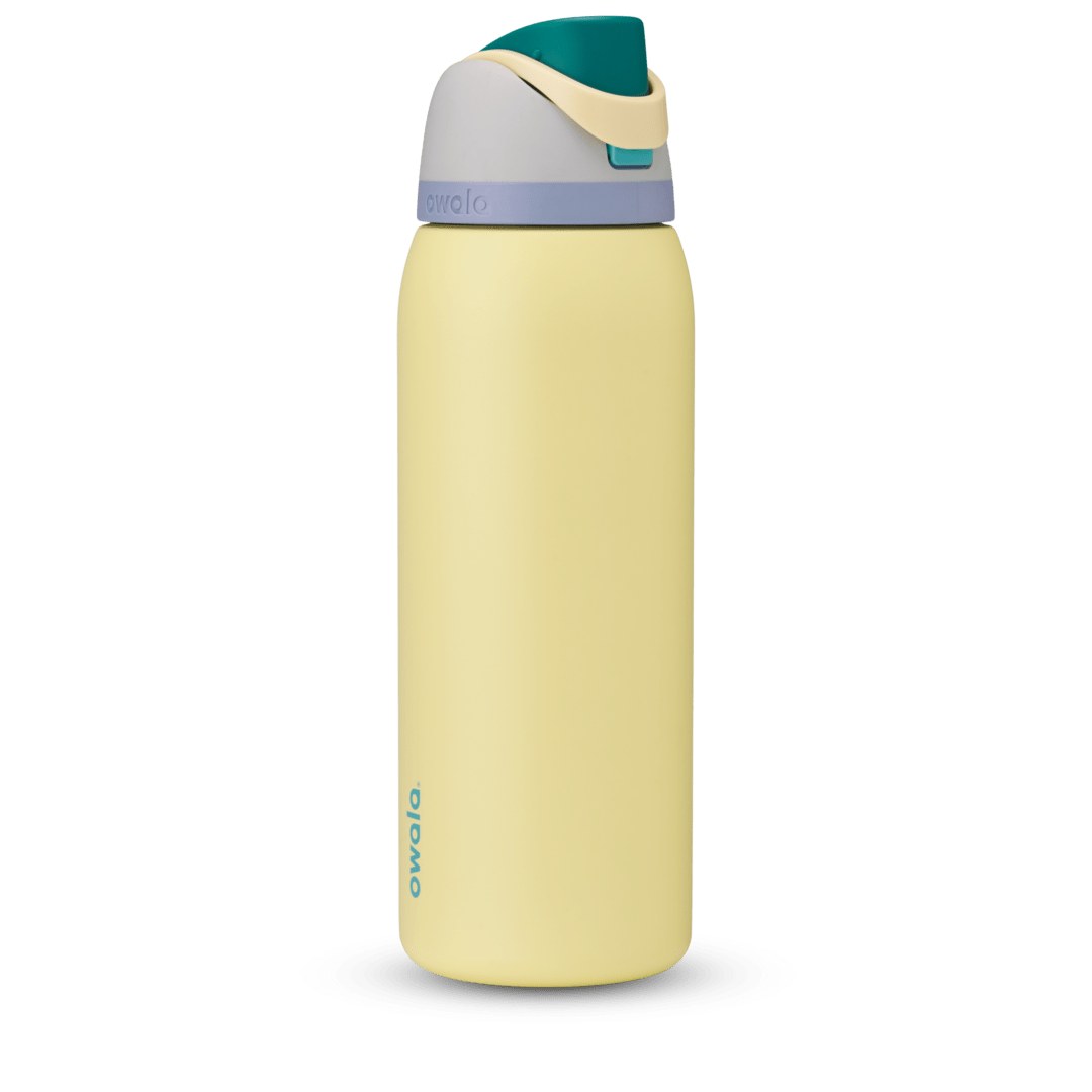 FreeSip 40oz in Sunny Daze, soft yellow body with teal flip cap, cream carry loop, gray lid, and lavender accent band