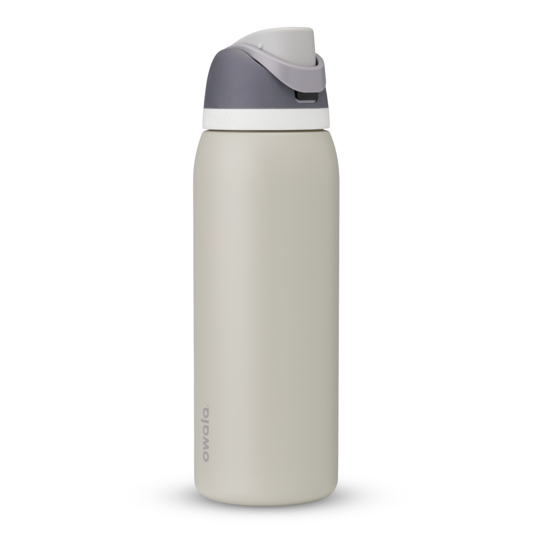 FreeSip 40oz in Rock On, cream stone body with dark grey flip cap, light grey carry loop, and white accent band