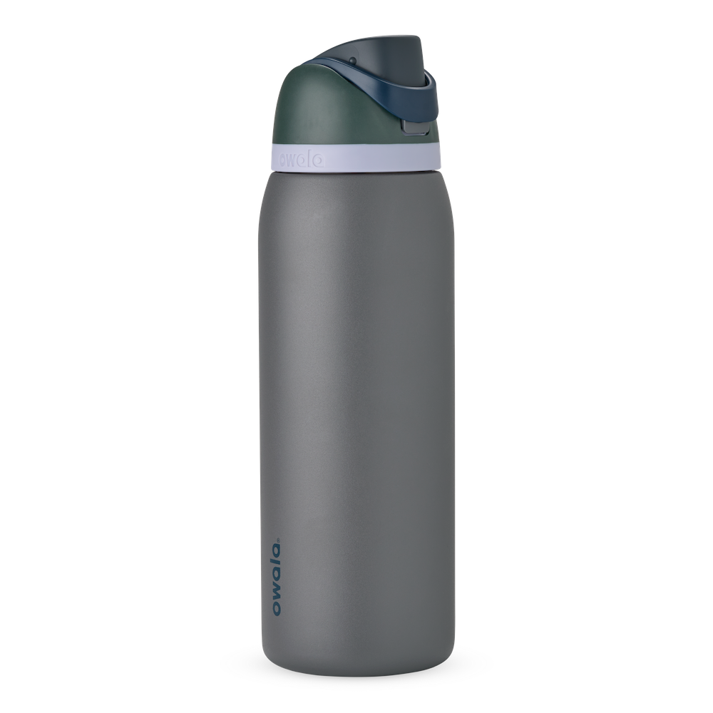 FreeSip 40oz in Off the Grid, charcoal grey body with dark forest green flip cap, navy blue carry loop, and pale lavender accent band