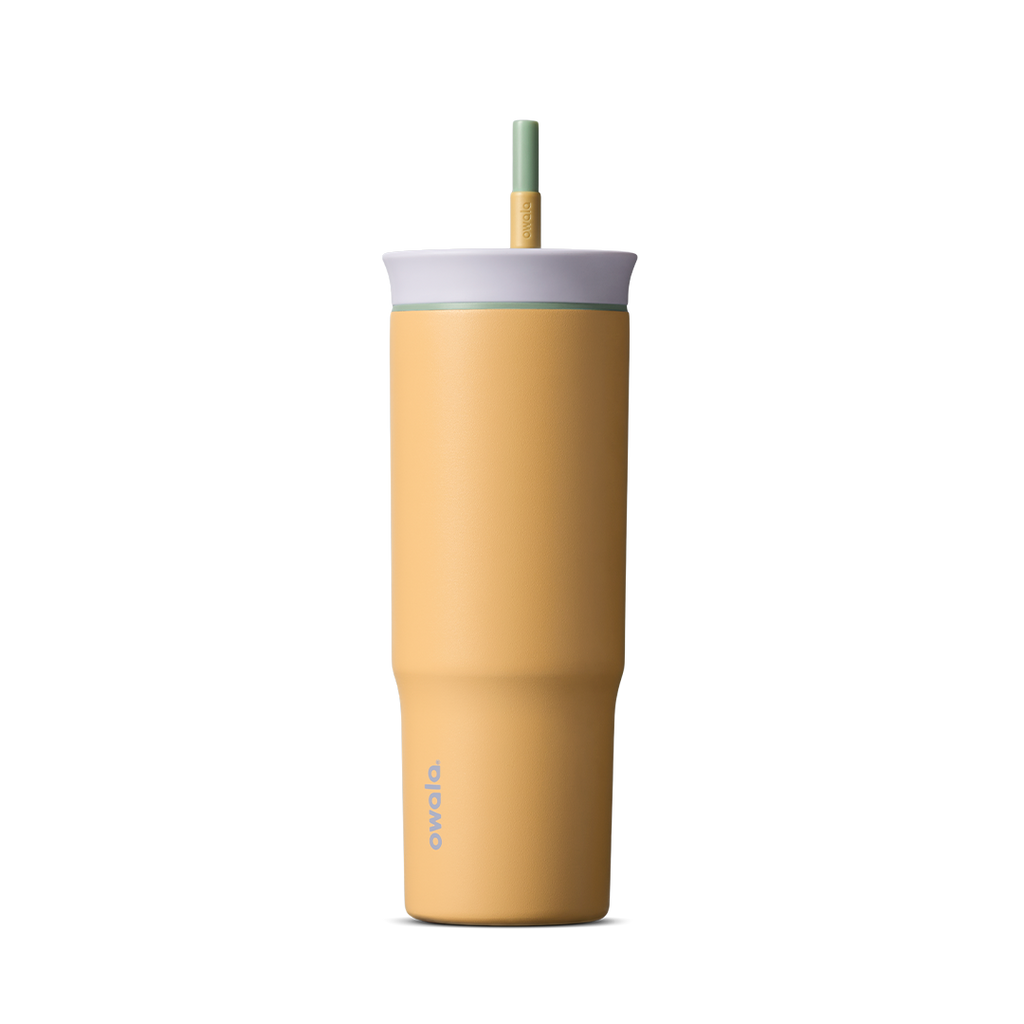 24oz Tumbler in Beachfront; matte warm yellow insulated tumbler with light gray lid and green-tipped straw, Owala wordmark on front