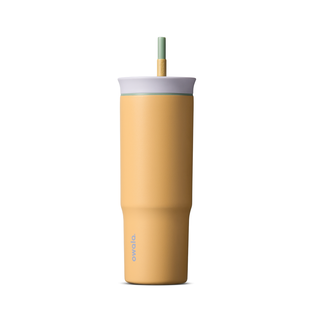24oz Tumbler in Beachfront; matte warm yellow insulated tumbler with light gray lid and green-tipped straw, Owala wordmark on front