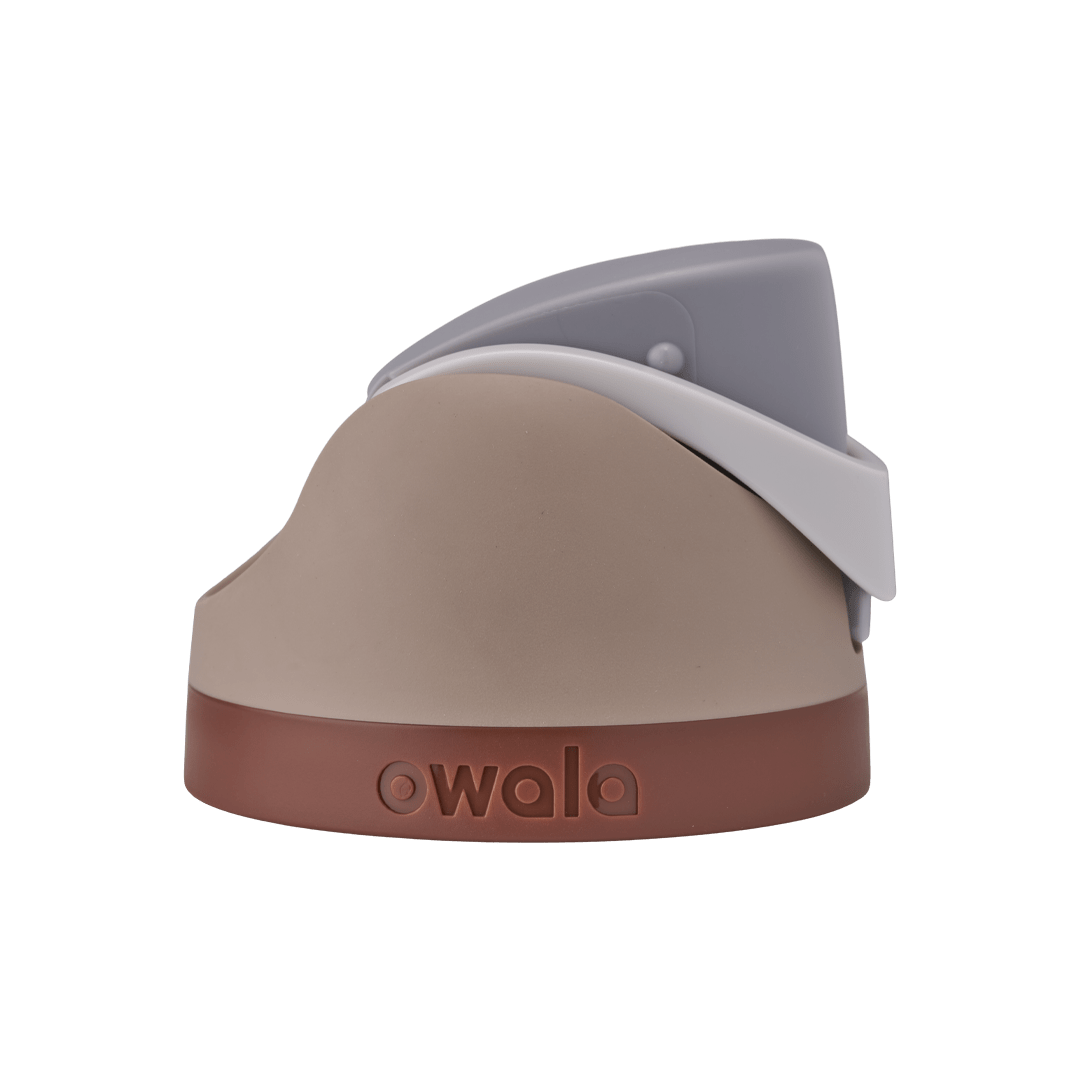 Owala FreeSip replacement lid in Calm Waters, tan beige body with light gray flip cap and carry loop and rust brown base accent band