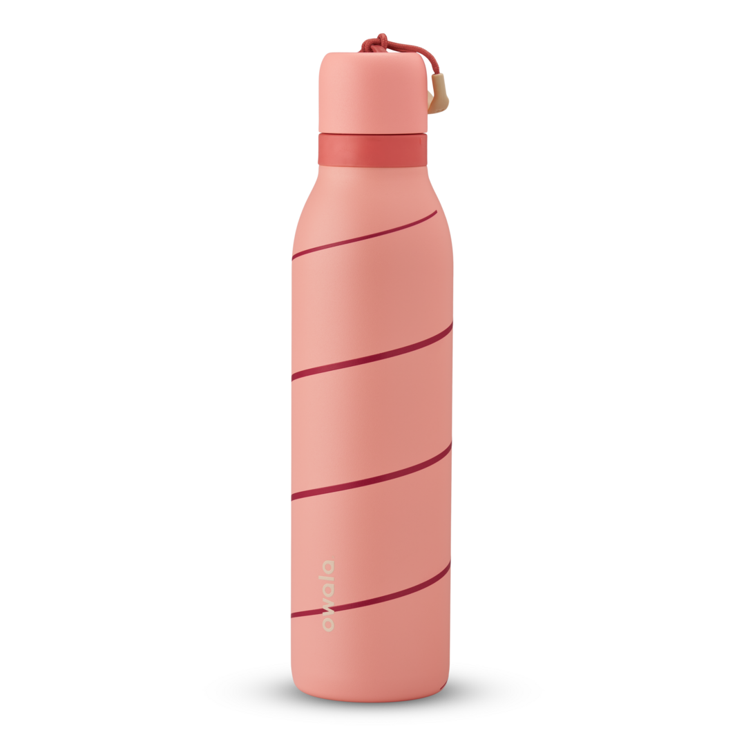FreeSip Twist 24oz in Candy Cane Lane, coral pink insulated water bottle with diagonal dark red candy-cane stripe pattern, matching pink twist cap, and red carry loop