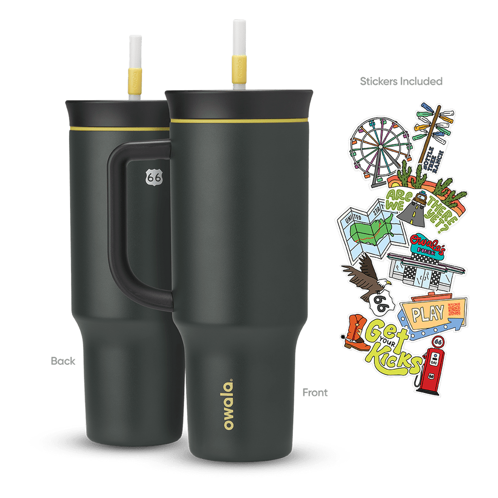 Great American Road Trip Tumbler 40oz in Route 66 (dark charcoal-black body and handle with yellow accent ring and white straw), back and front views shown with included Route 66-themed stickers featuring a Ferris wheel, motel signs, gas pump, and roadside icons