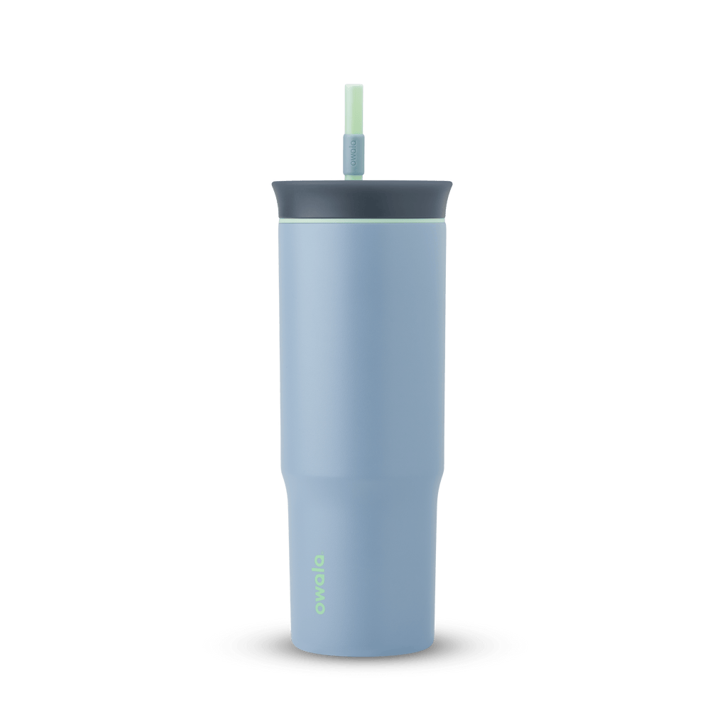 24oz Tumbler in Lost Valley; matte denim-blue insulated tumbler with dark slate-gray lid, mint green accent ring, and matching mint green straw, Owala wordmark on front