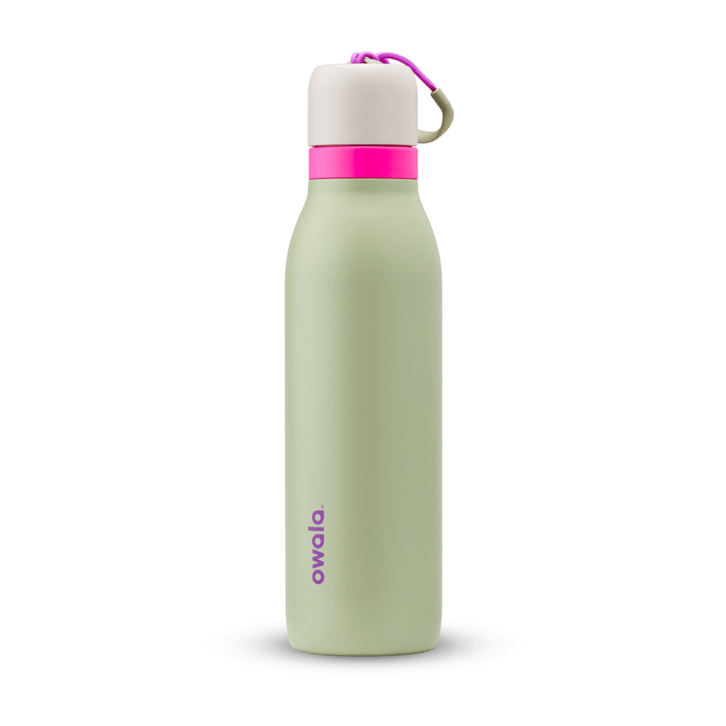 FreeSip Twist 18oz in Neo Sage, sage green insulated water bottle with cream twist cap, hot pink twist cap accent band, magenta carry string, and purple Owala logo