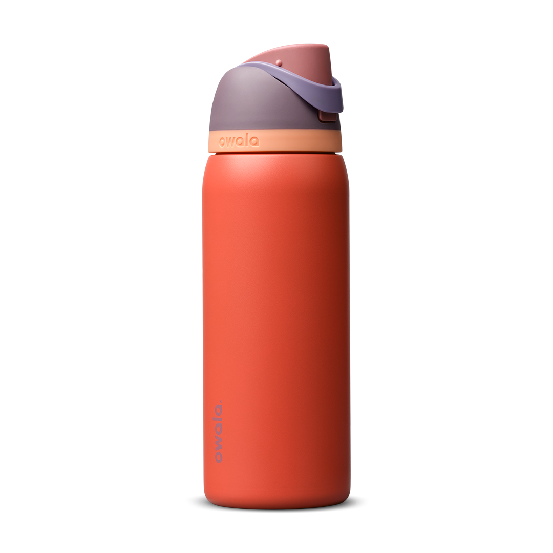 FreeSip 32oz in Terracotta Sunset, warm terracotta orange insulated bottle with muted mauve purple flip cap and peach accent band