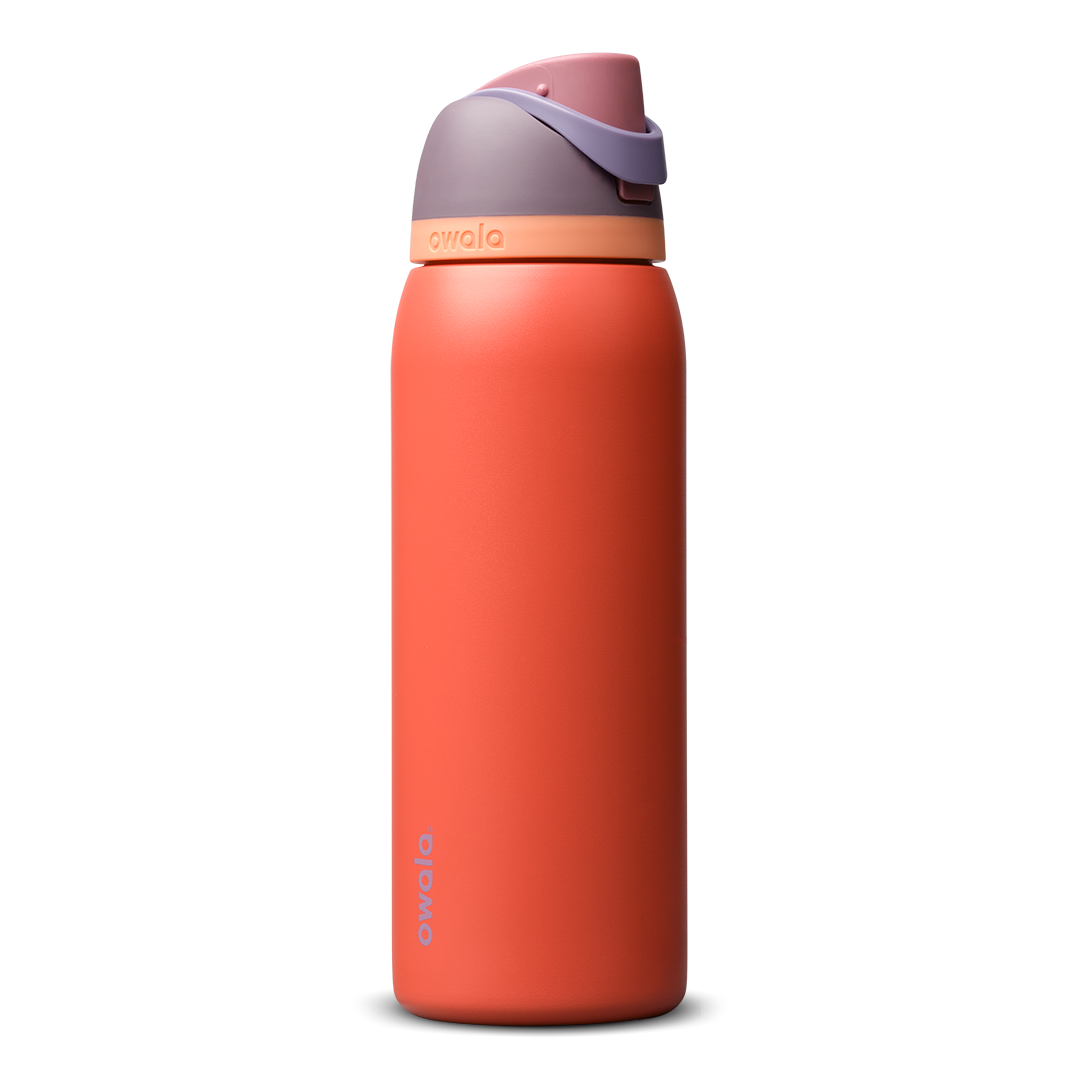 FreeSip 40oz in Terracotta Sunset, warm terracotta orange insulated bottle with muted mauve purple flip cap and peach accent band