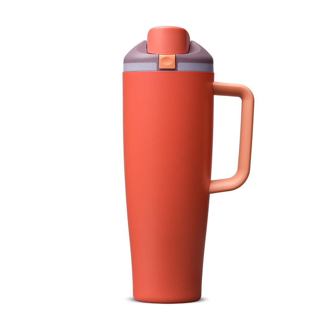 FreeSip Tumbler 40oz Terracotta Sunset, terracotta orange body with matching terracotta flip cap, dusty mauve push-button and lid, lavender accent band, and orange handle