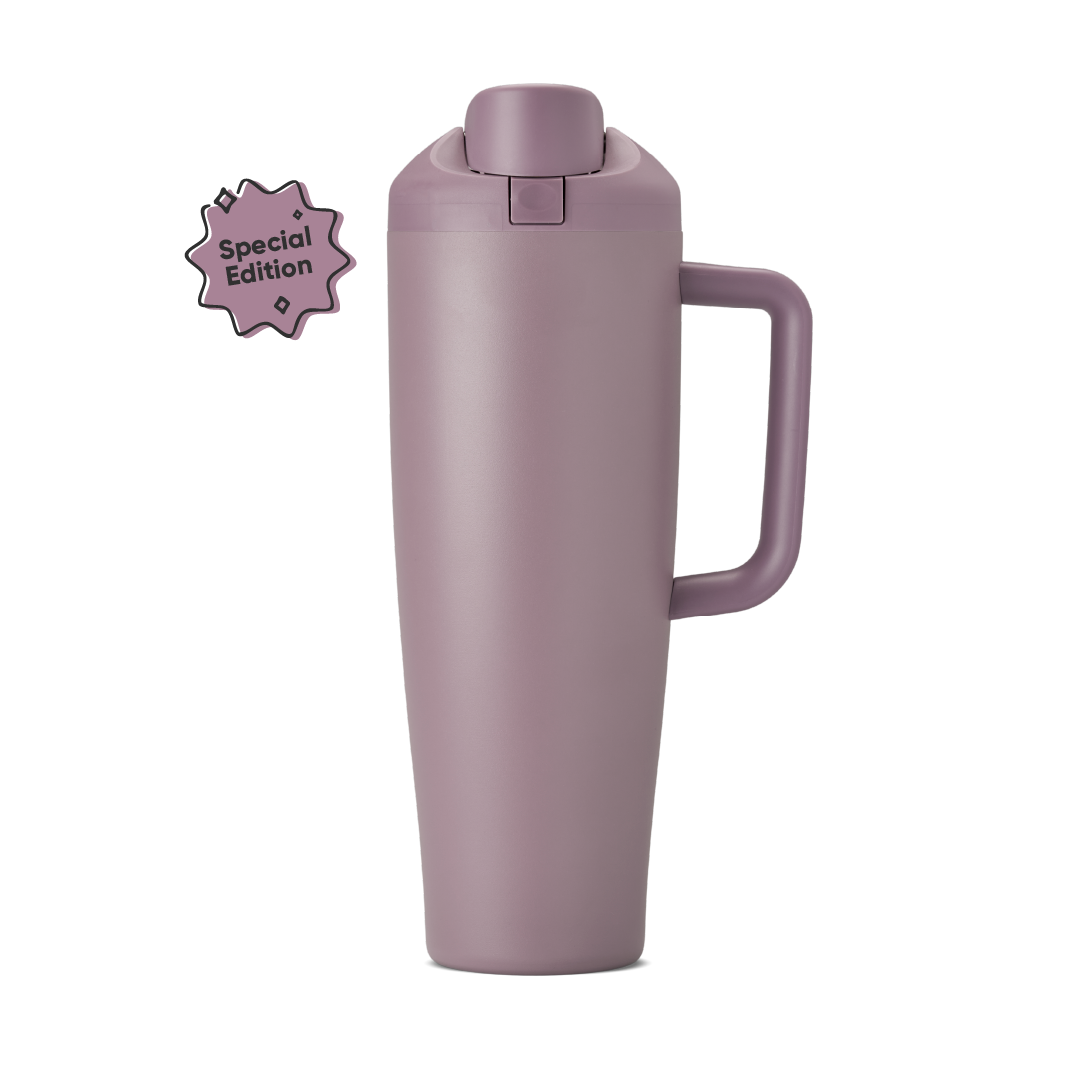 FreeSip Tumbler 40oz in Spring Revival, dusty mauve-purple insulated cup with matching flip cap, push-button, lid, and side handle