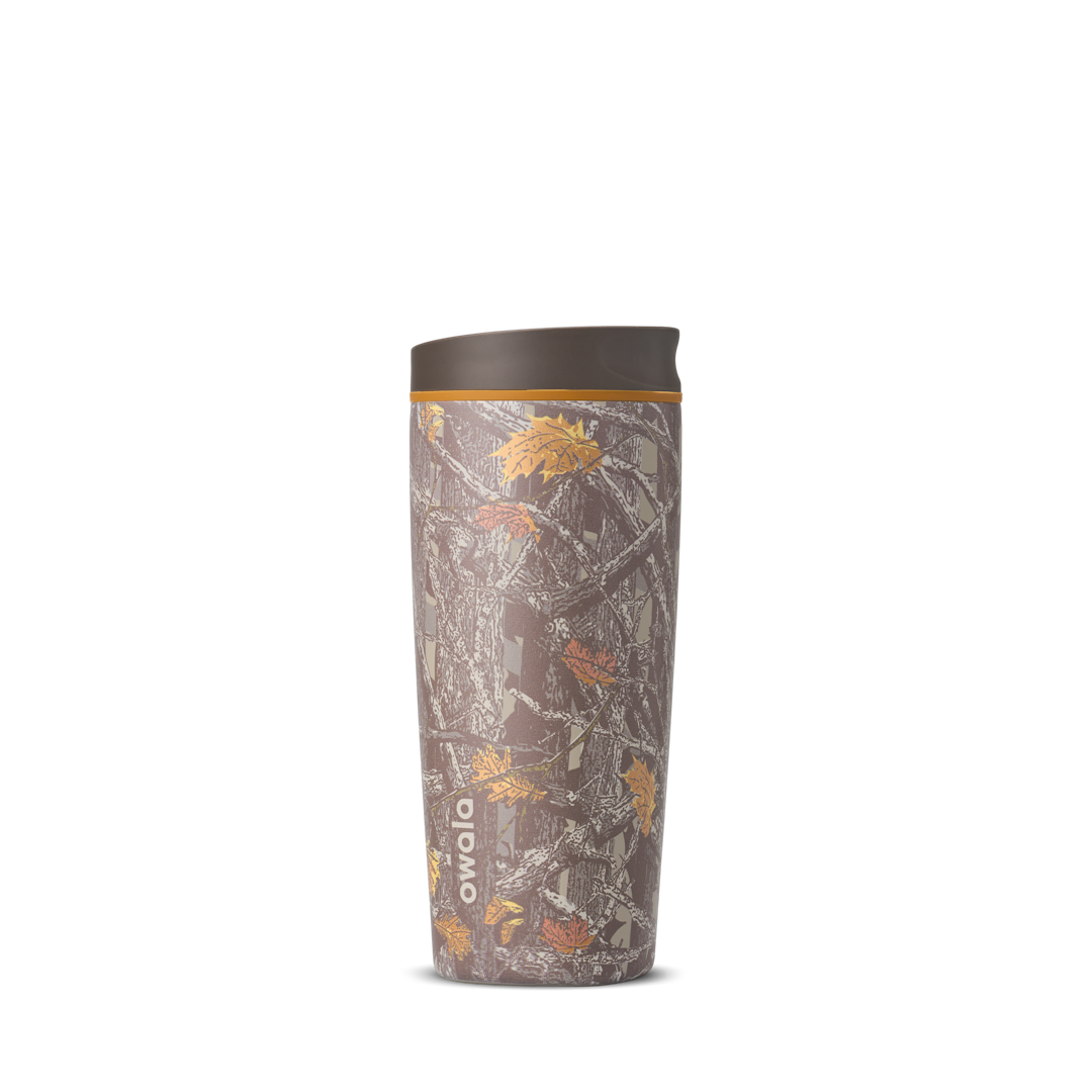 SmoothSip Slider 20oz in Out of Sight, brown forest Mossy Oak camouflage print with leaves and branches across the body, brown lid, and orange accent ring