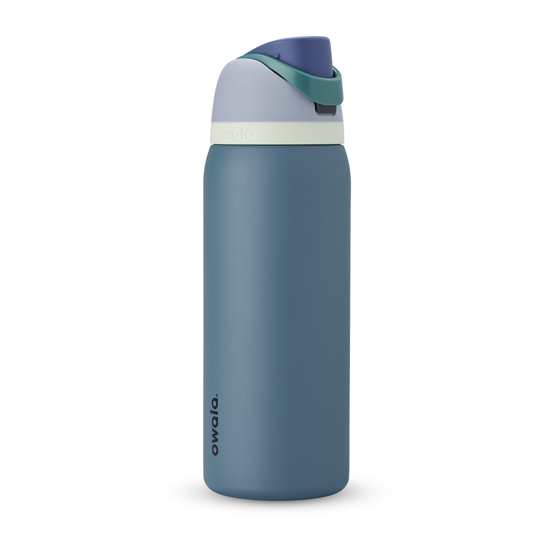 FreeSip 40oz in Denim, muted teal blue insulated bottle with dusty navy flip cap and pale cream accent band