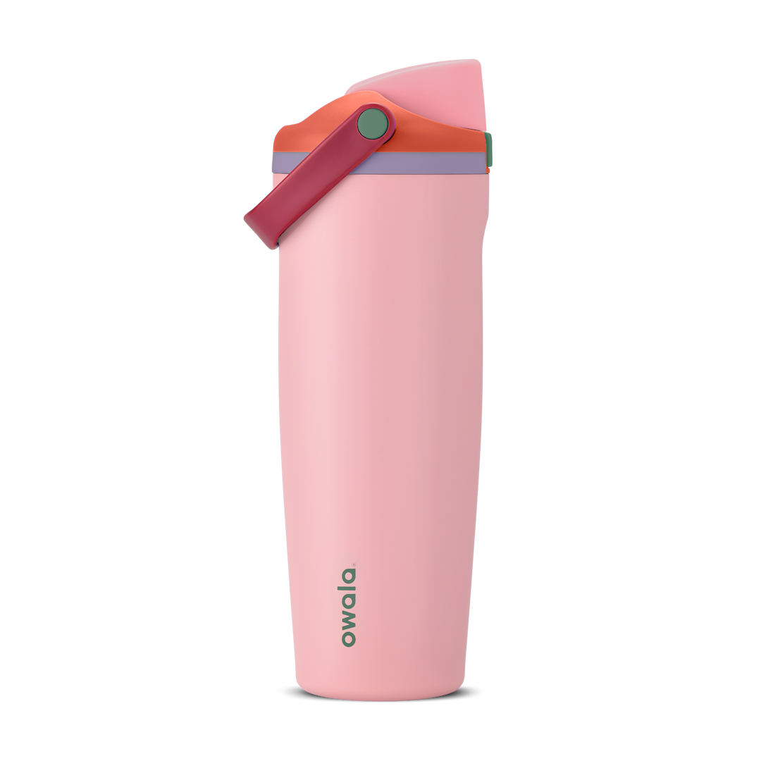 FreeSip Sway 30oz in Sugar High, soft pink insulated water bottle with red-orange flip cap, deep magenta carry loop, lavender lid accent ring and green push-button, lid open