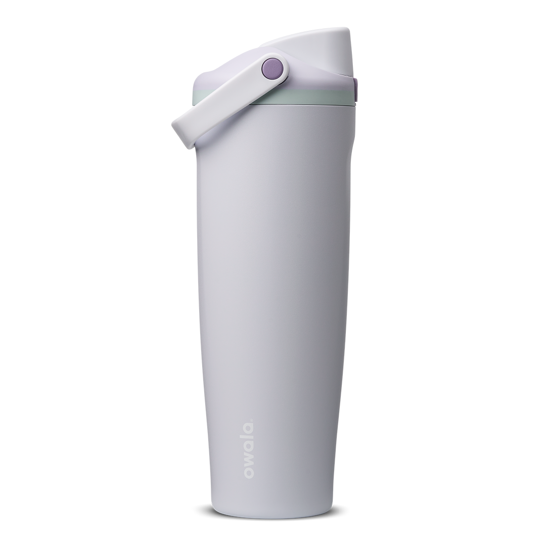 FreeSip Sway 40oz in Open Air, pale lavender-grey insulated water bottle with matching lavender flip cap and carry loop, sage green lid accent ring and purple push-button, lid open