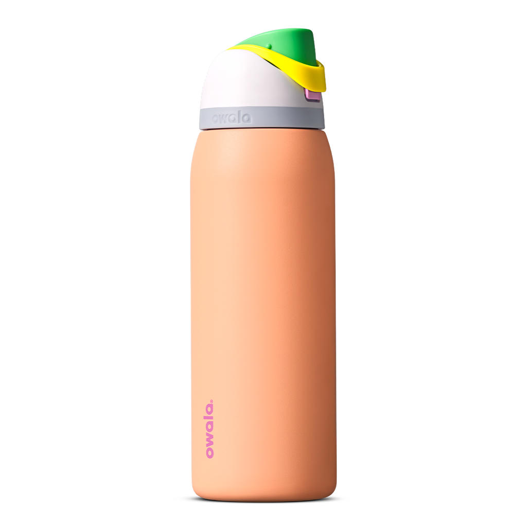 FreeSip 40oz in Peachy Keen, soft peach orange insulated bottle with white flip cap lid, yellow flip tab, and bright green carry loop