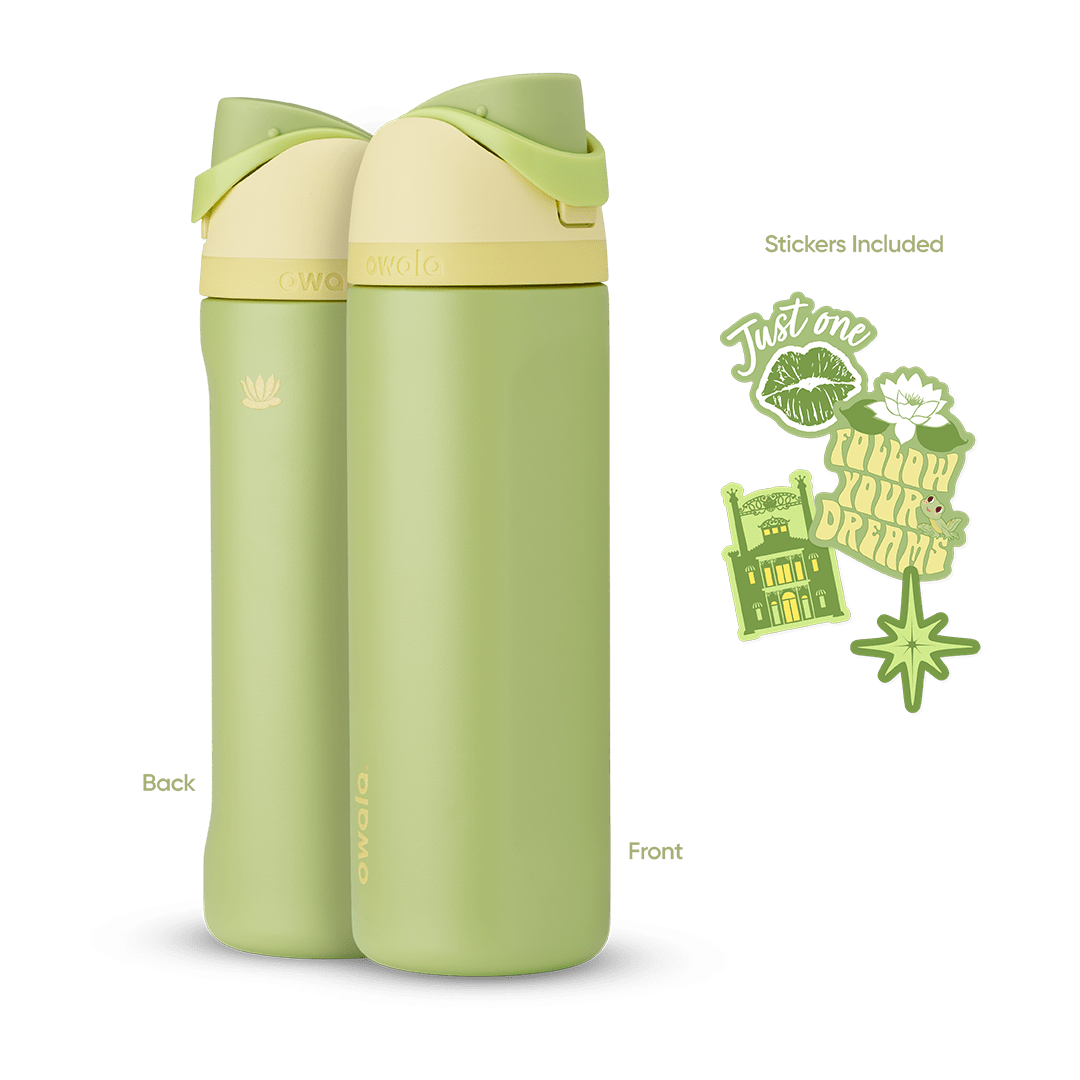 FreeSip 24oz in Tiana, olive green insulated bottle with cream flip cap, green carry loop, and pale yellow lid, shown front and back with included "Just One" lipstick kiss, water lily, "Follow Your Dreams" trolley, and green star stickers