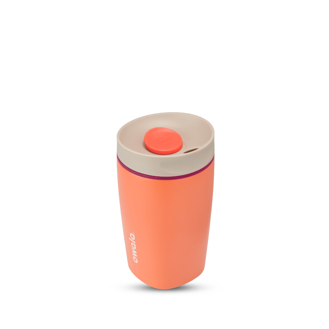 SmoothSip Slider 12oz in Campfire Nights, coral orange body with cream lid, red-orange slider button, magenta accent ring, and white Owala logo