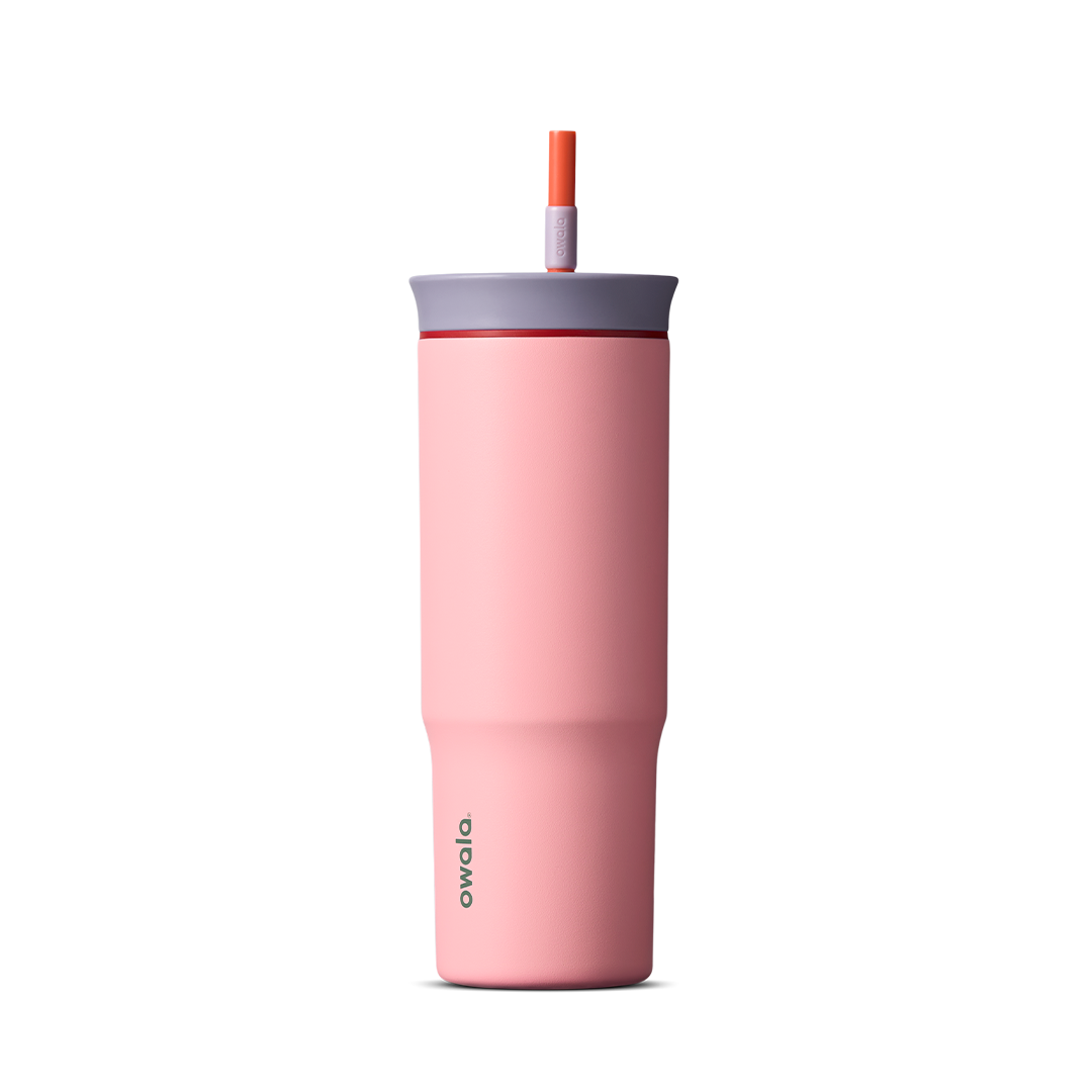 24oz Tumbler in Sugar High; matte coral-pink insulated tumbler with lavender-gray lid and orange-red straw, Owala wordmark on front