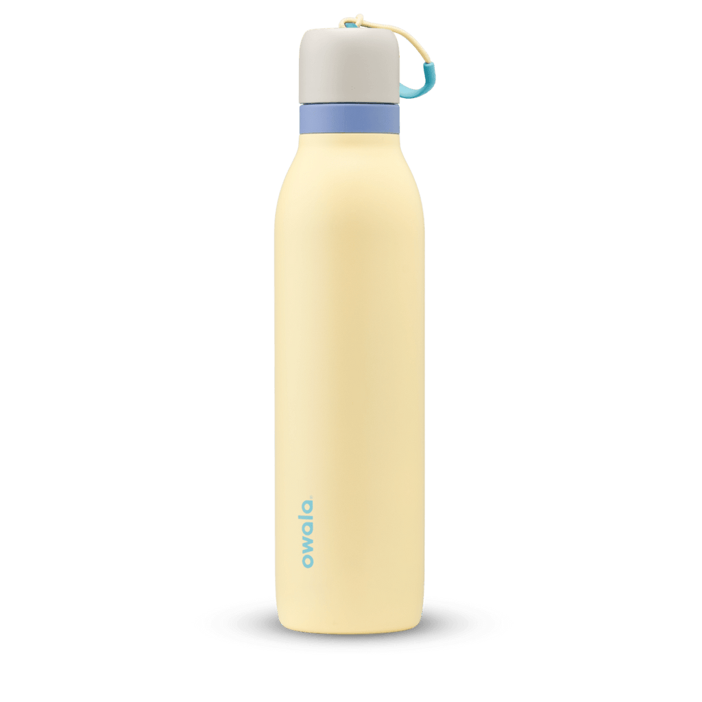 FreeSip Twist 24oz in Sunny Daze, pale yellow insulated water bottle with light gray twist cap, periwinkle blue twist cap accent band, and teal carry string with grip