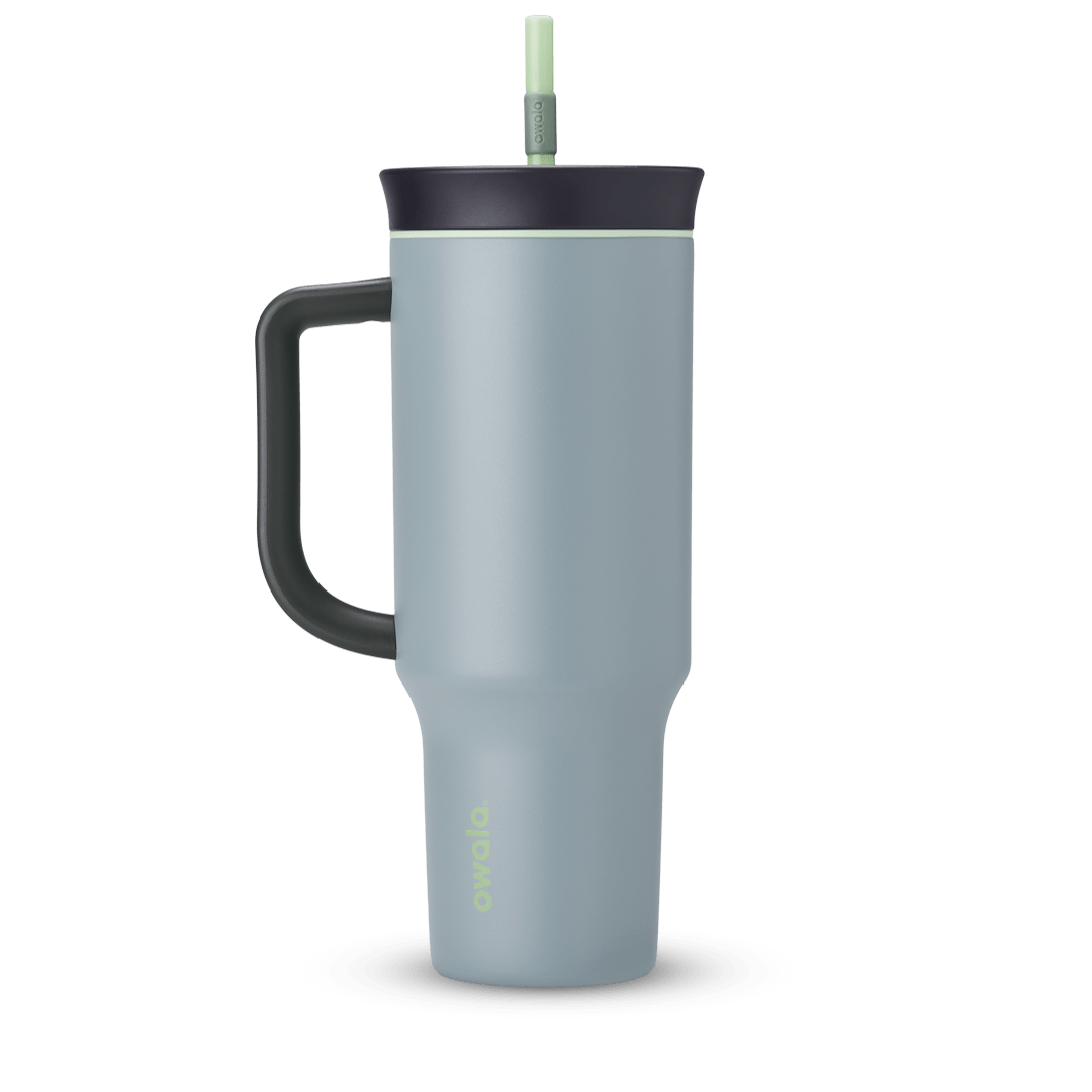 40oz Tumbler in Lost Valley, dusty blue-grey insulated tumbler with black handle, black lid with sage green accent ring, and pale green straw