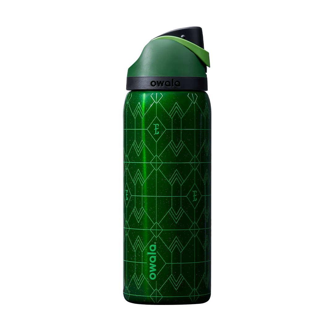 Rotating view of Wicked Elphaba edition FreeSip bottle; deep emerald green body with geometric diamond-pattern texture, dark green flip cap, and bright green carry loop