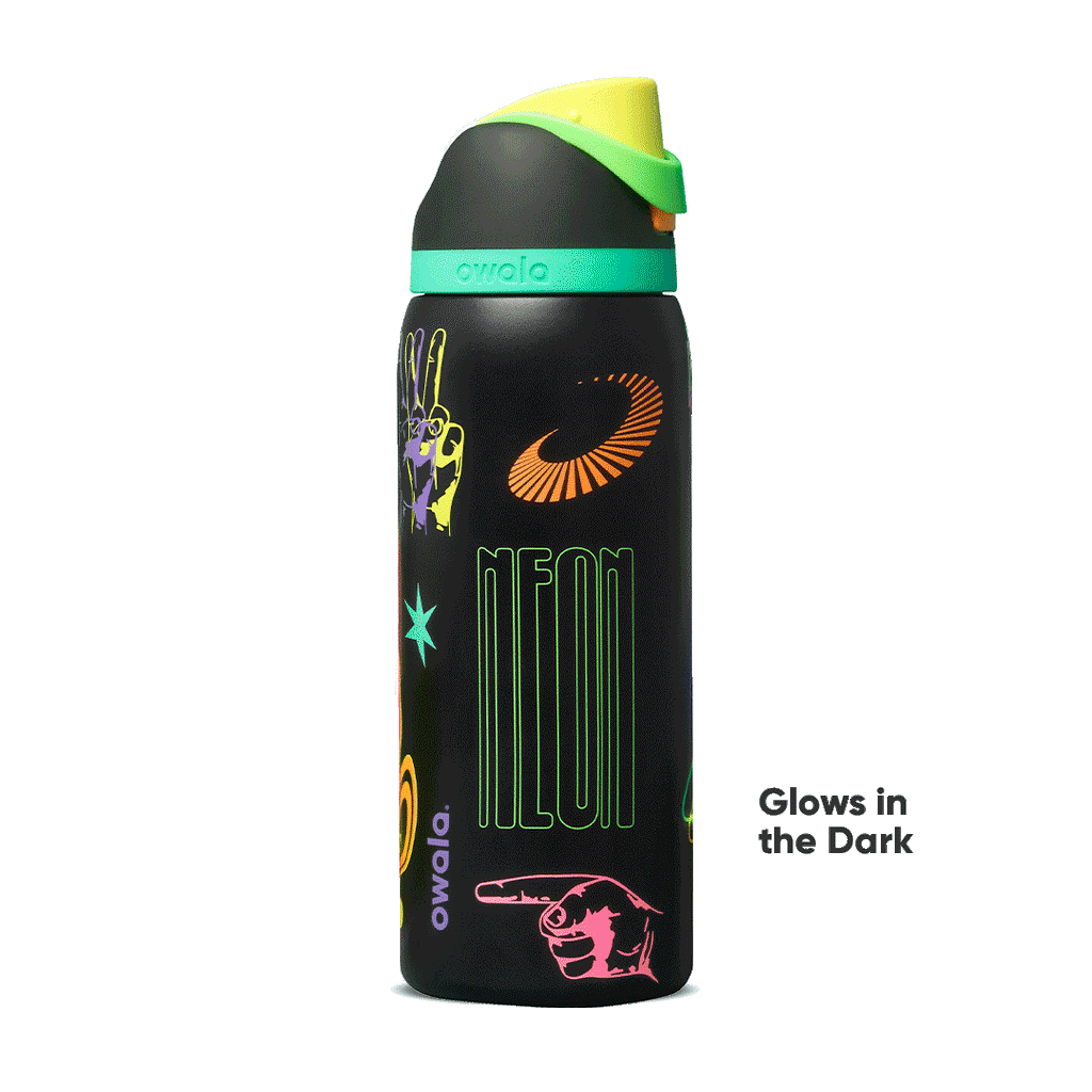 FreeSip 32oz in All Systems Glow, matte black body with neon graphic patches and mint green flip cap; glows in the dark