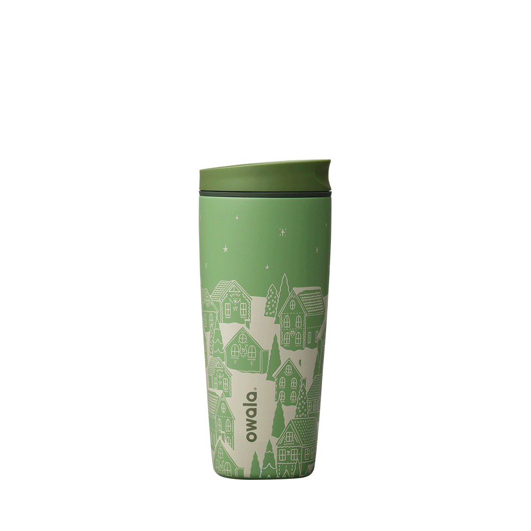 SmoothSip Slider 20oz in Gingerbread, light yellow-green body with dark green accent band, white print of gingerbread houses and trees on a snowy landscape under a starry sky