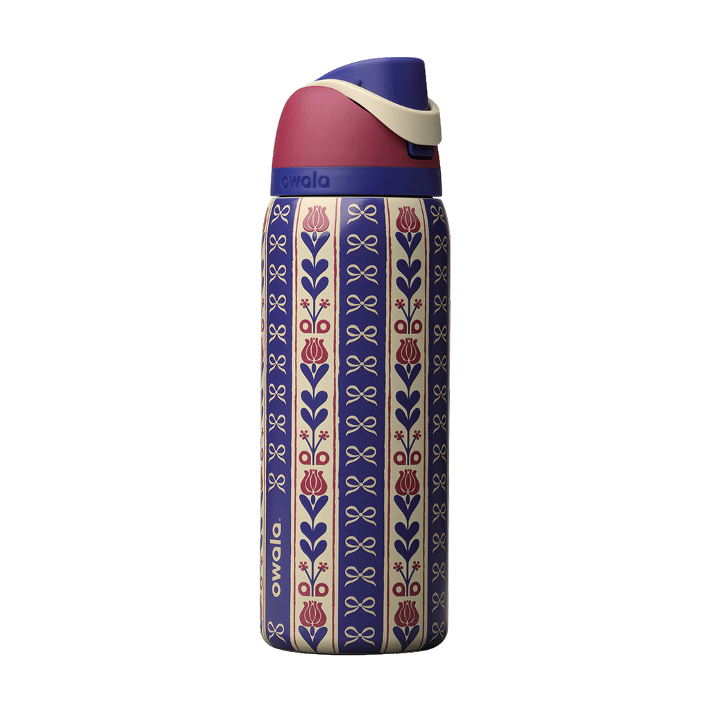FreeSip 32oz Holiday Hygge; rotating view of cream and navy blue striped body with vertical floral motifs of red tulips and navy bows in a folk-art pattern, dusty rose flip cap, cream carry loop, and navy blue lid